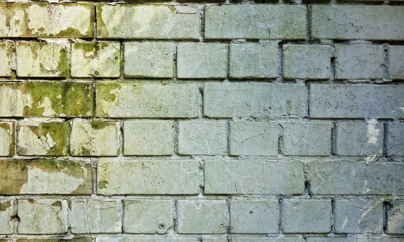 a damaged brick wall