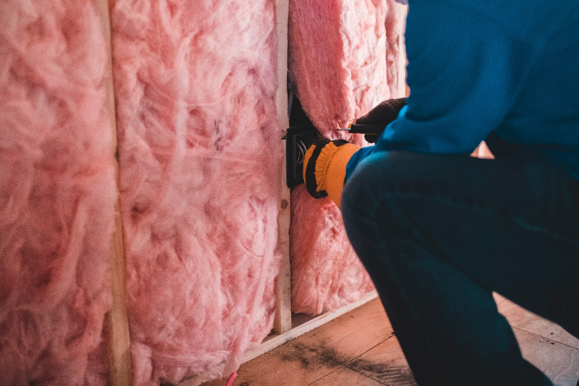 a home inspector checking insulation