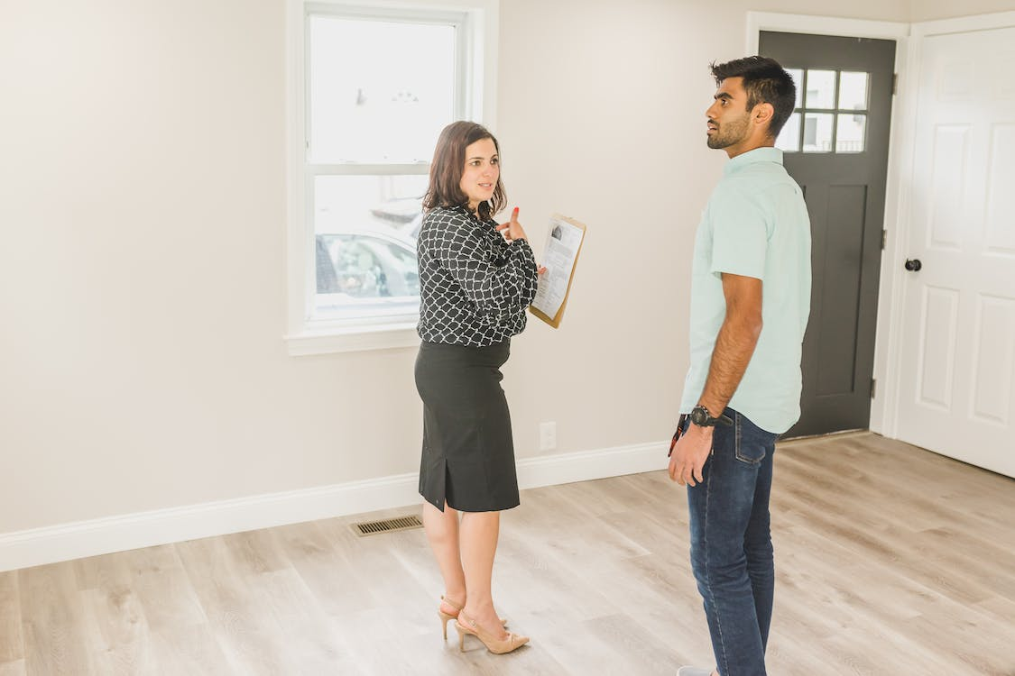 home inspector with a buyer during a home inspection